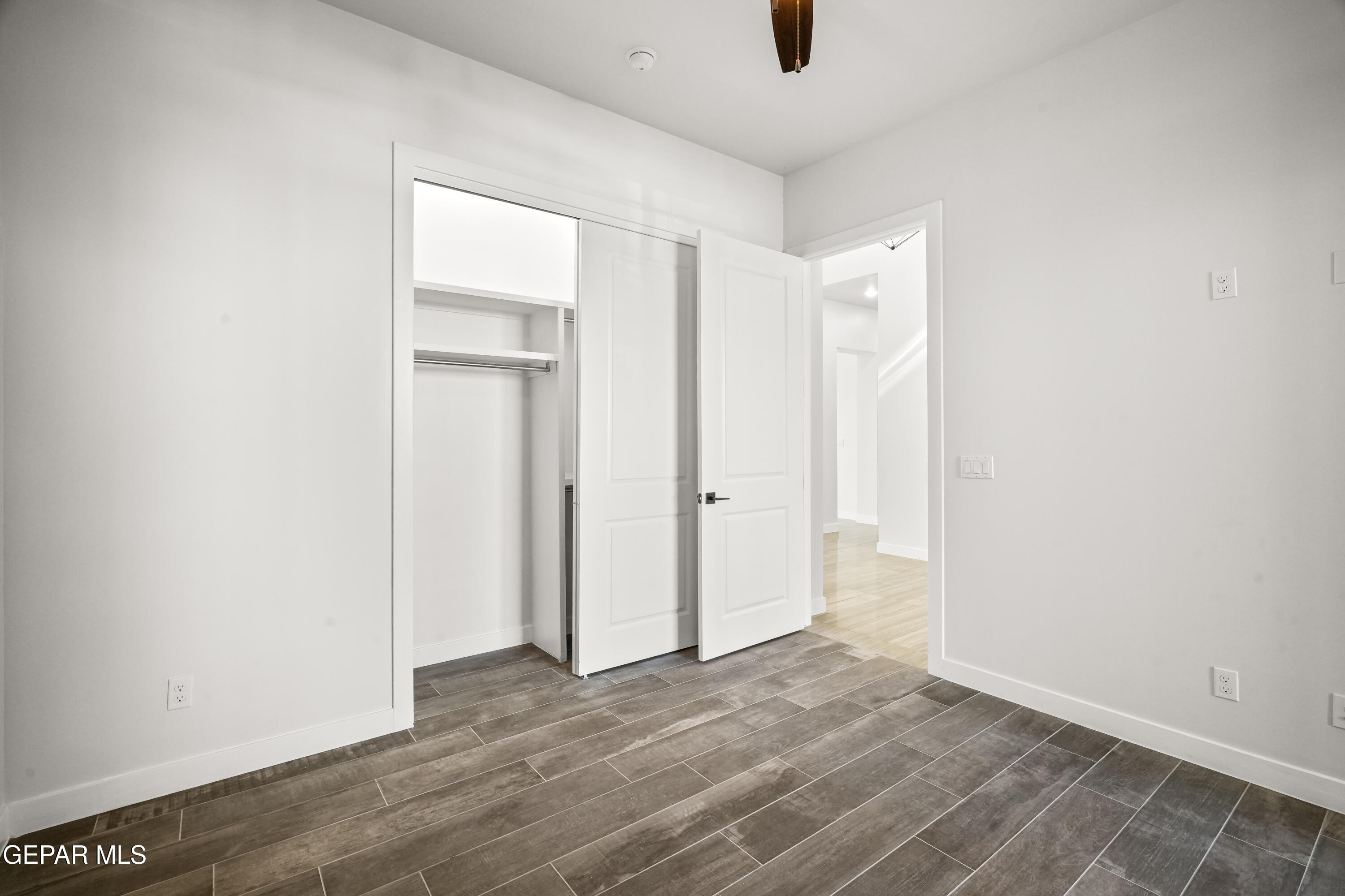 360 Rio De Jazmin Circle El Paso, TX 79932 - Photo 40 of 66 a view of an empty room with wooden floor