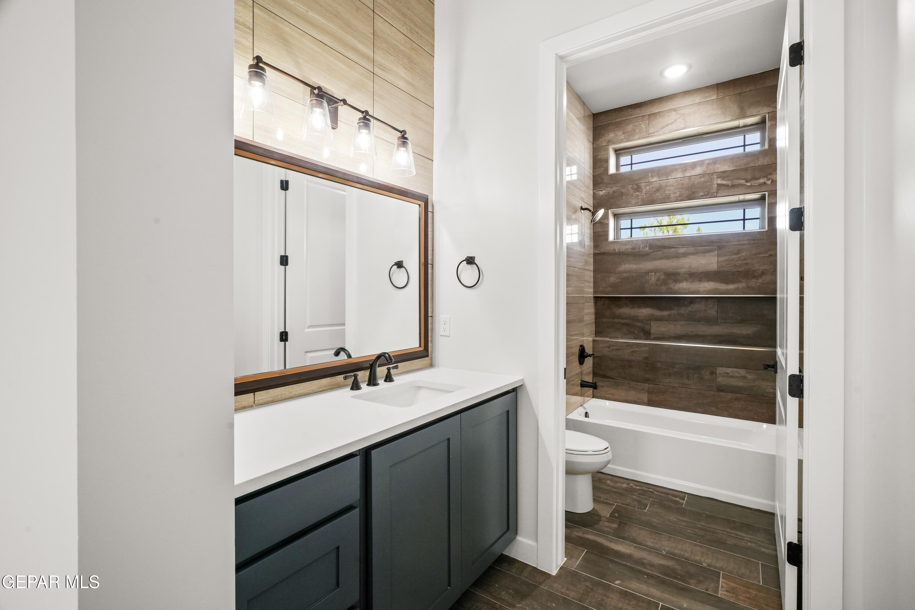 360 Rio De Jazmin Circle El Paso, TX 79932 - Photo 48 of 66 a bathroom with a double vanity sink a toilet and a mirror