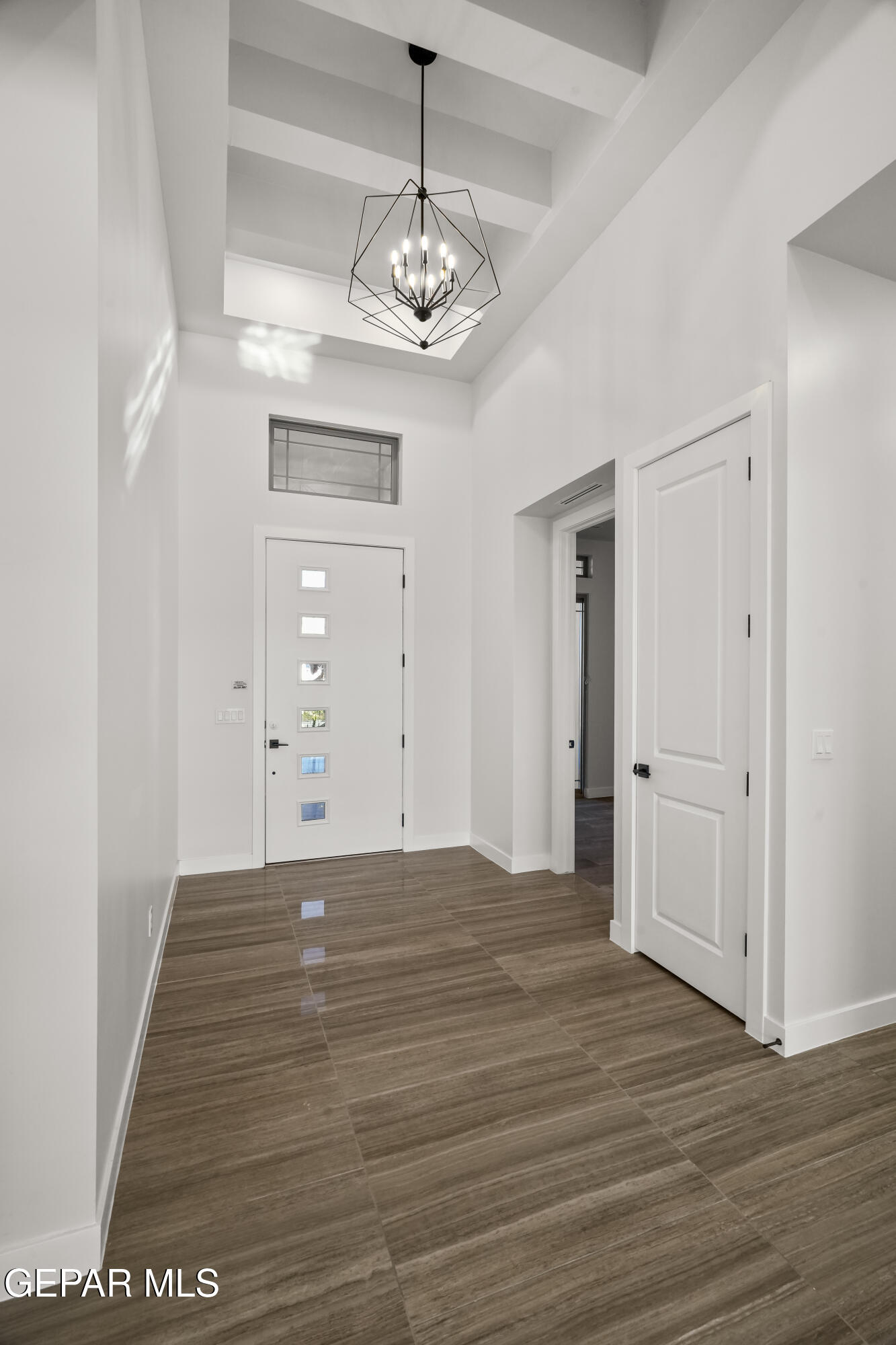 360 Rio De Jazmin Circle El Paso, TX 79932 - Photo 6 of 66 a view of a room with wooden floor and chandelier
