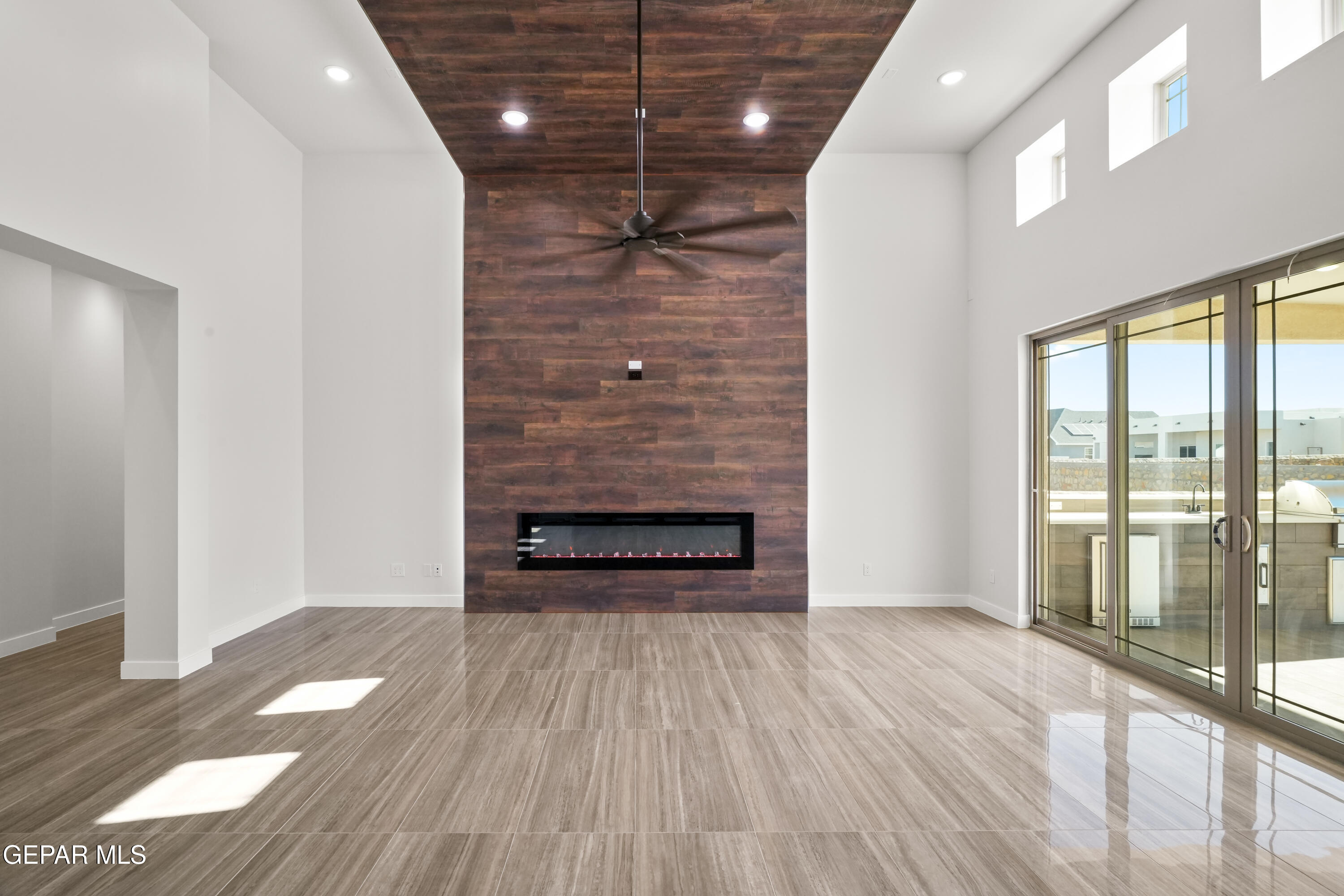 360 Rio De Jazmin Circle El Paso, TX 79932 - Photo 9 of 66 a view of empty room with wooden floor and fan