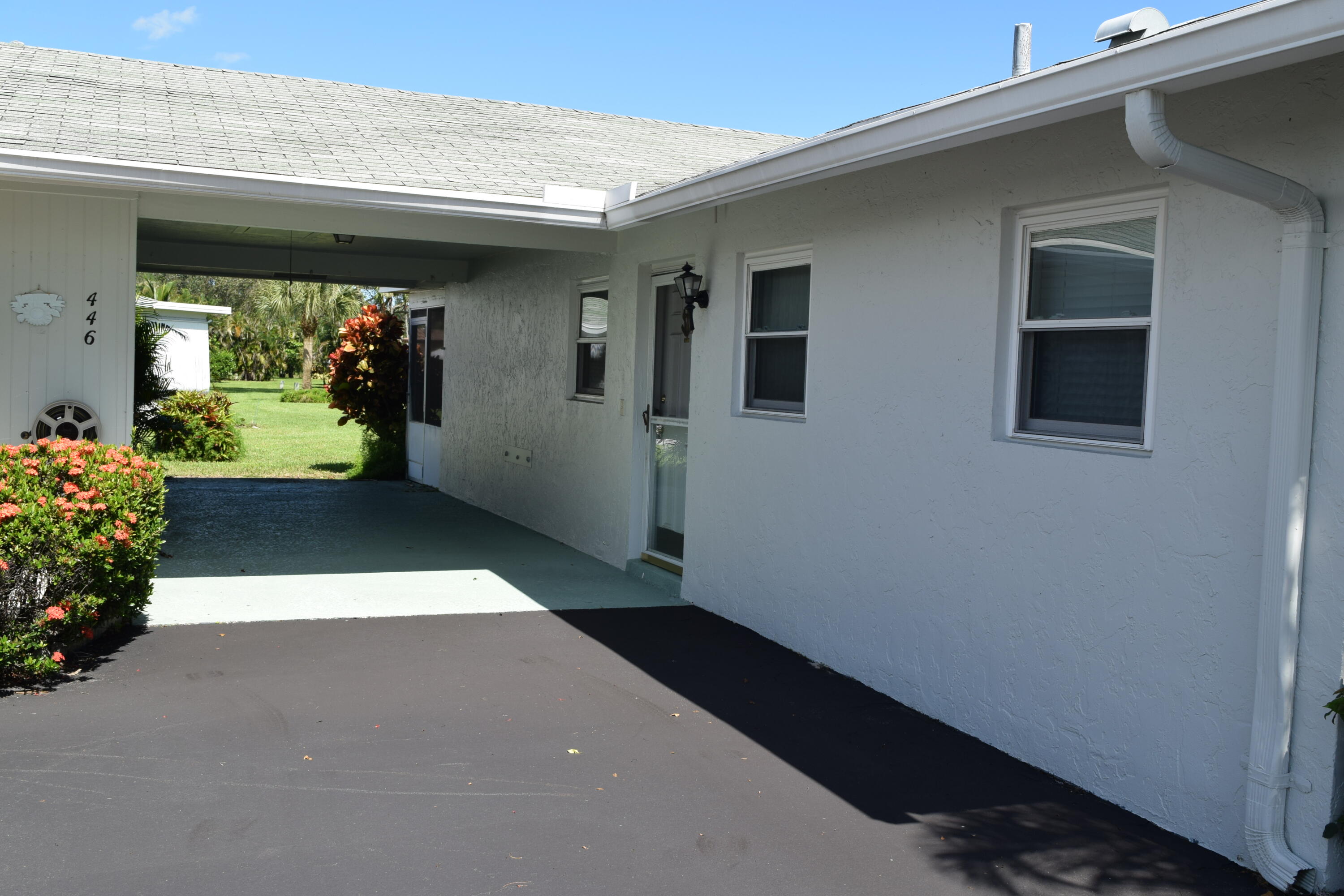 446 Bluebird Lane Delray Beach, FL 33445 - Photo 2 of 16 a living room with furniture and a potted plant
