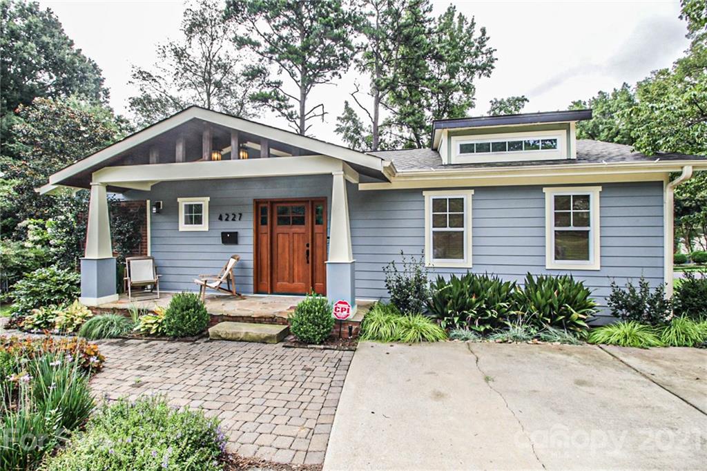 4227 Murrayhill Road Charlotte, NC 28209 - Photo 2 of 24 a front view of a house with a yard and trees