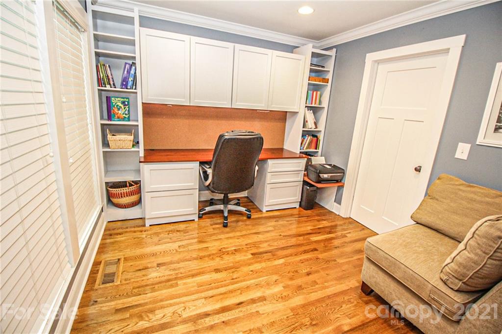 4227 Murrayhill Road Charlotte, NC 28209 - Photo 12 of 24 a view of a workspace with furniture and a window