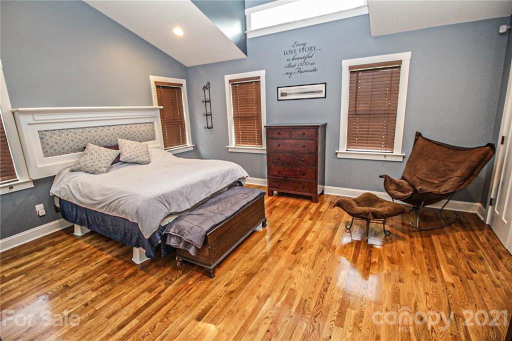 4227 Murrayhill Road Charlotte, NC 28209 - Photo 13 of 24 a bedroom with a bed and chair