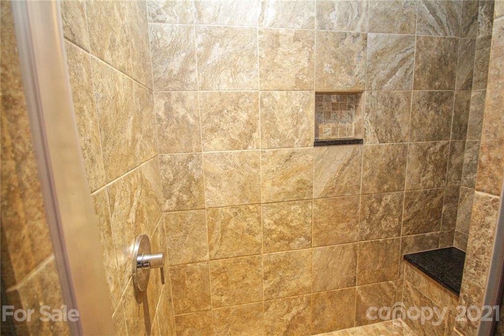 4227 Murrayhill Road Charlotte, NC 28209 - Photo 16 of 24 a bathroom with a shower