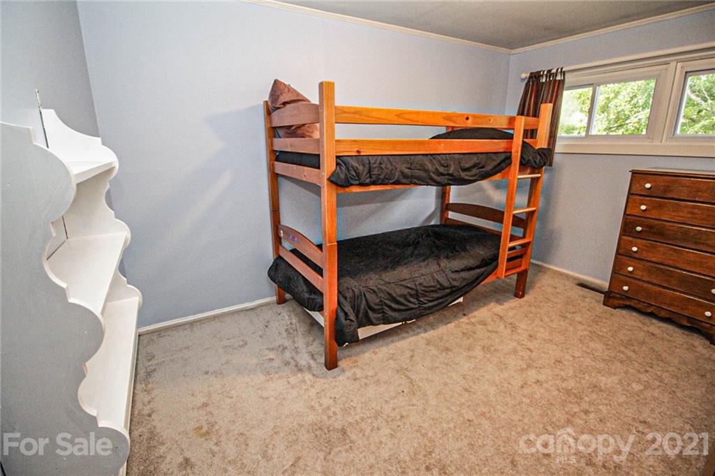 4227 Murrayhill Road Charlotte, NC 28209 - Photo 20 of 24 a bedroom with bunk beds and a window