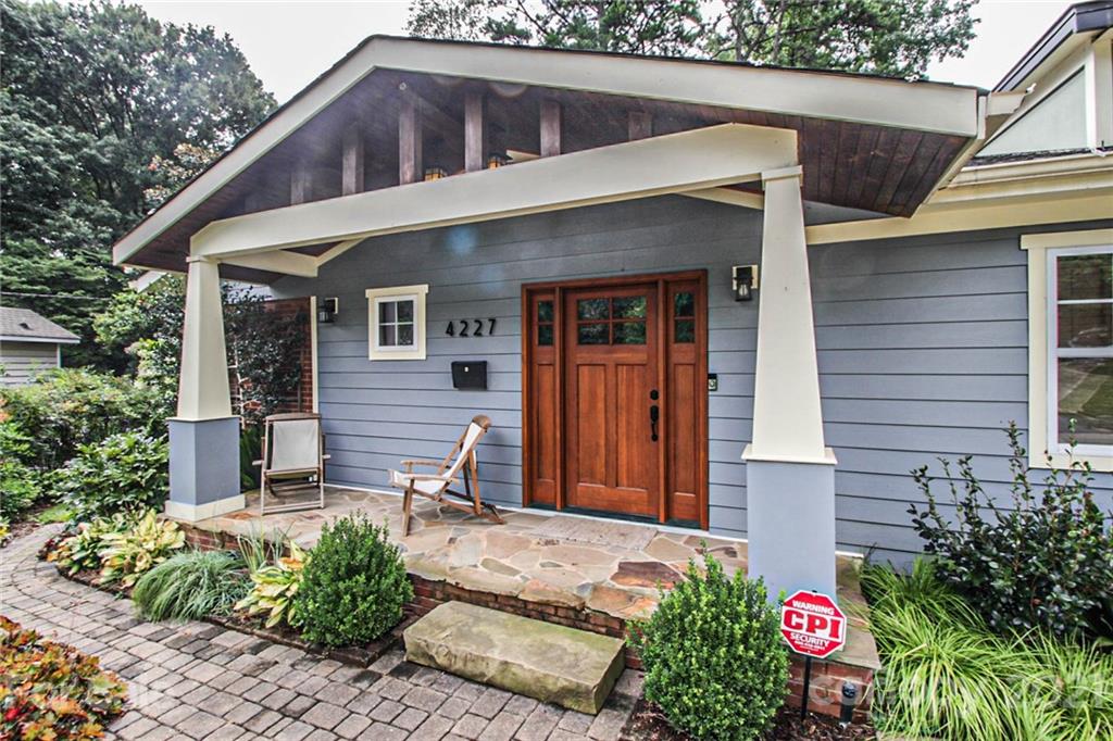 4227 Murrayhill Road Charlotte, NC 28209 - Photo 3 of 24 a front view of a house with garden