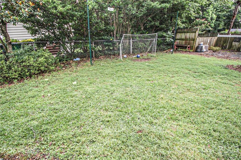 4227 Murrayhill Road Charlotte, NC 28209 - Photo 24 of 24 a backyard of a house with bicycles parked and entertaining space