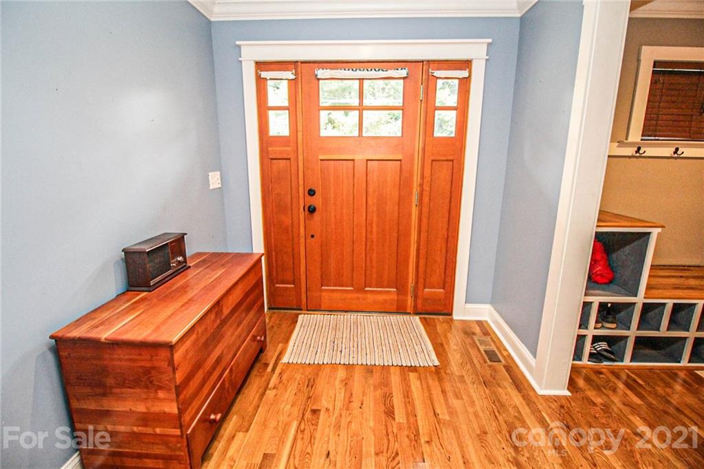 4227 Murrayhill Road Charlotte, NC 28209 - Photo 5 of 24 a bedroom with a bed and wooden floor