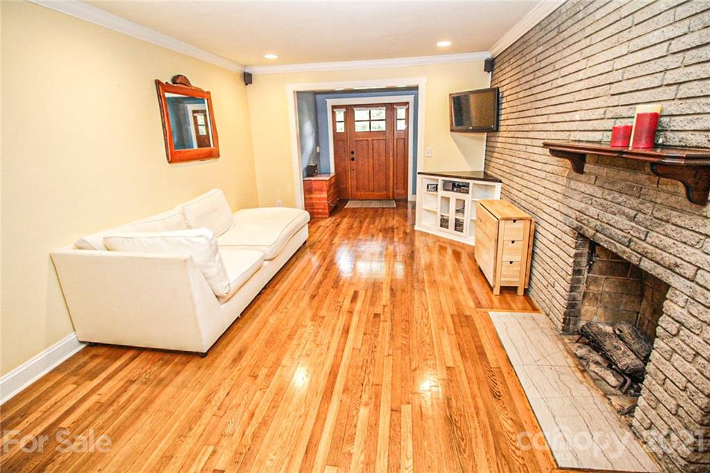 4227 Murrayhill Road Charlotte, NC 28209 - Photo 8 of 24 a spacious bedroom with a bed and wooden floor