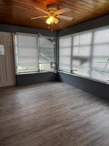a view of an empty room with a window
