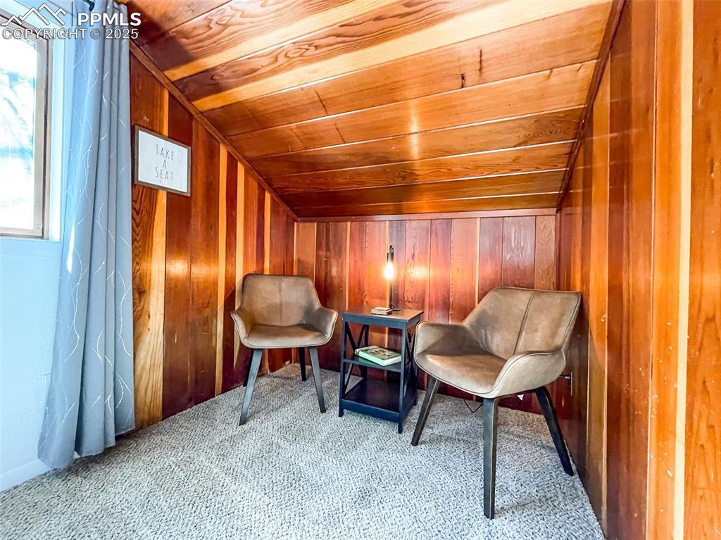 6025 Sioux Trail Cascade, CO 80809 - Photo 20 of 42 a living room with furniture and a lamp