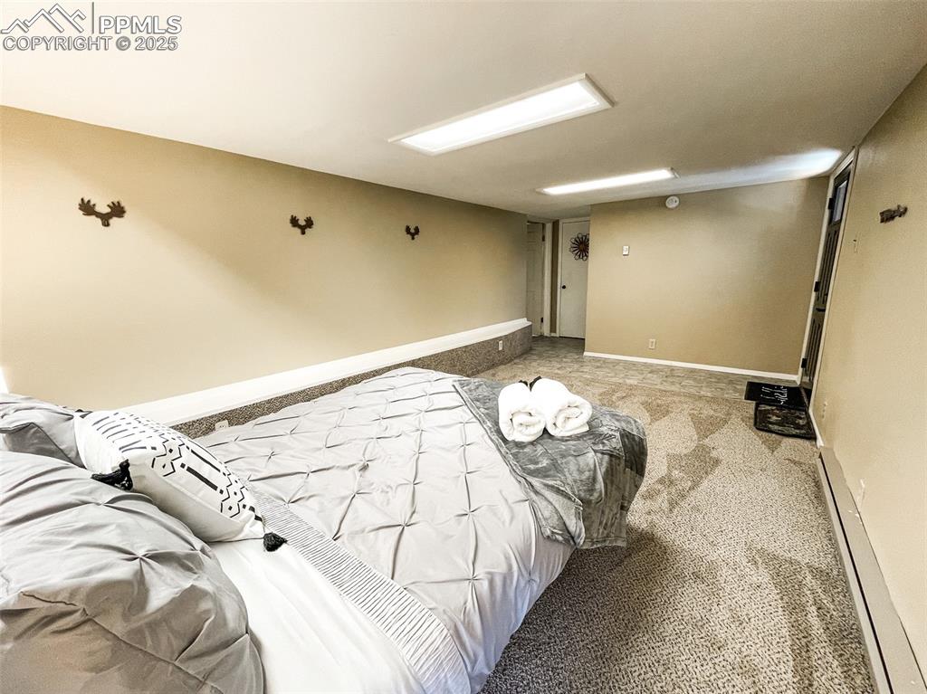 6025 Sioux Trail Cascade, CO 80809 - Photo 37 of 42 a bedroom with a bed and a window