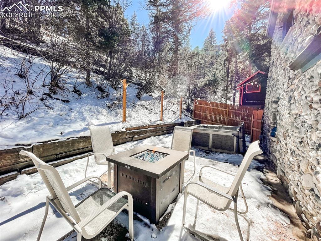 6025 Sioux Trail Cascade, CO 80809 - Photo 39 of 42 a view of a dinning table and chairs in the patio