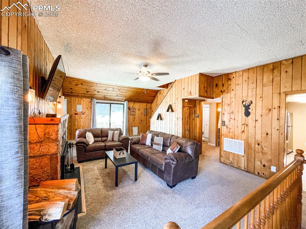 6025 Sioux Trail Cascade, CO 80809 - Photo 10 of 42 a living room with furniture and a large window