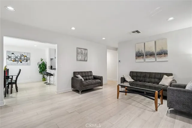 a view of a dining room with furniture and a window
