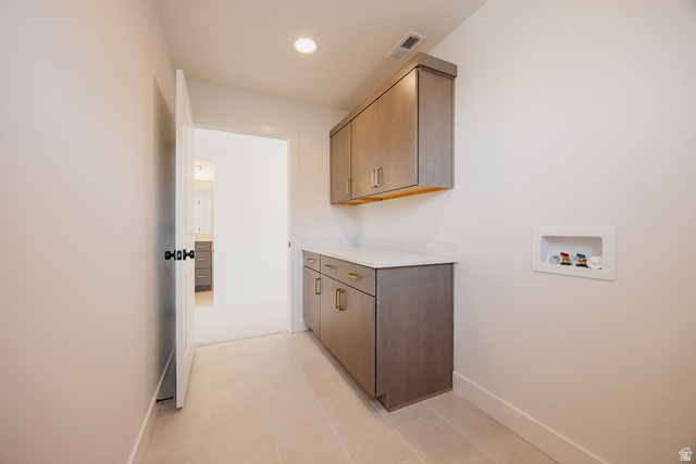 5902 Canyon Rim Road, Unit 620 Lehi, UT 84048 - Photo 53 of 78 Utility area featuring light-toned cabinetry, a solid surface countertop, and recessed lighting