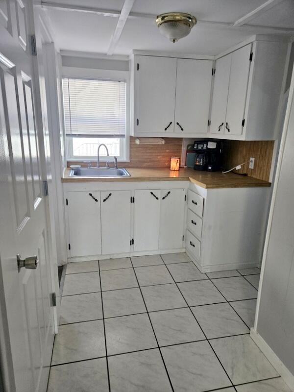 36 Perley Street Lewiston, ME 04240 - Photo 22 of 39 back cabinets in pantry near bathrm