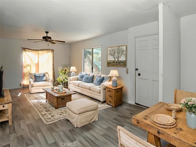 a living room with furniture rug and window