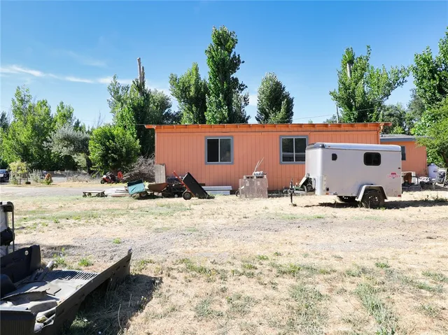 a view of a house with snow on the road