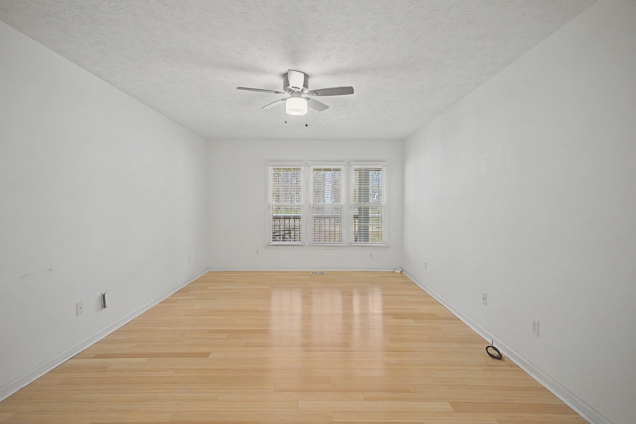 1081 Ridgecrest Drive Kingston Springs, TN 37082 - Photo 15 of 49 a view of empty room with wooden floor and fan