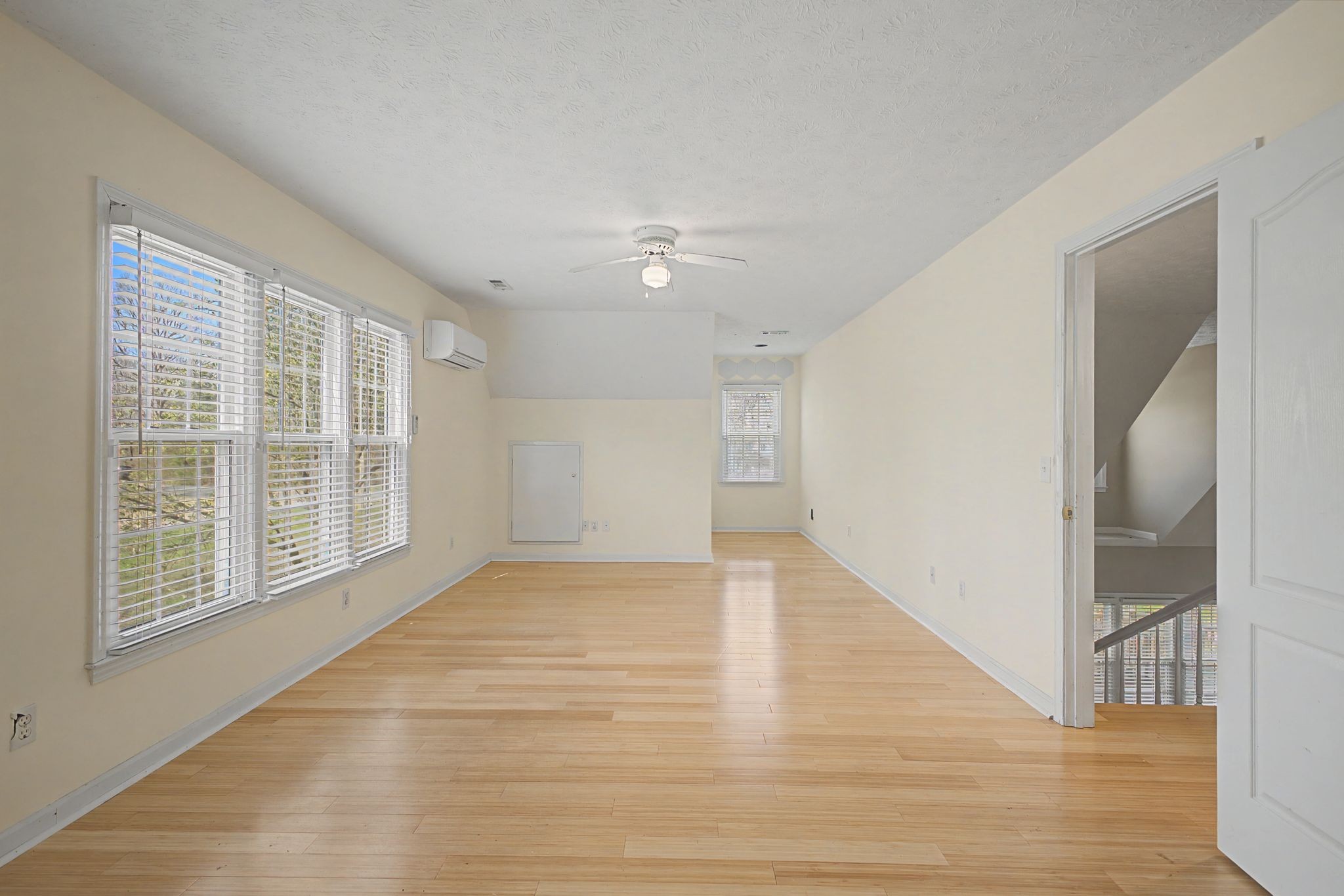 1081 Ridgecrest Drive Kingston Springs, TN 37082 - Photo 25 of 49 a view of an empty room with wooden floor and a window