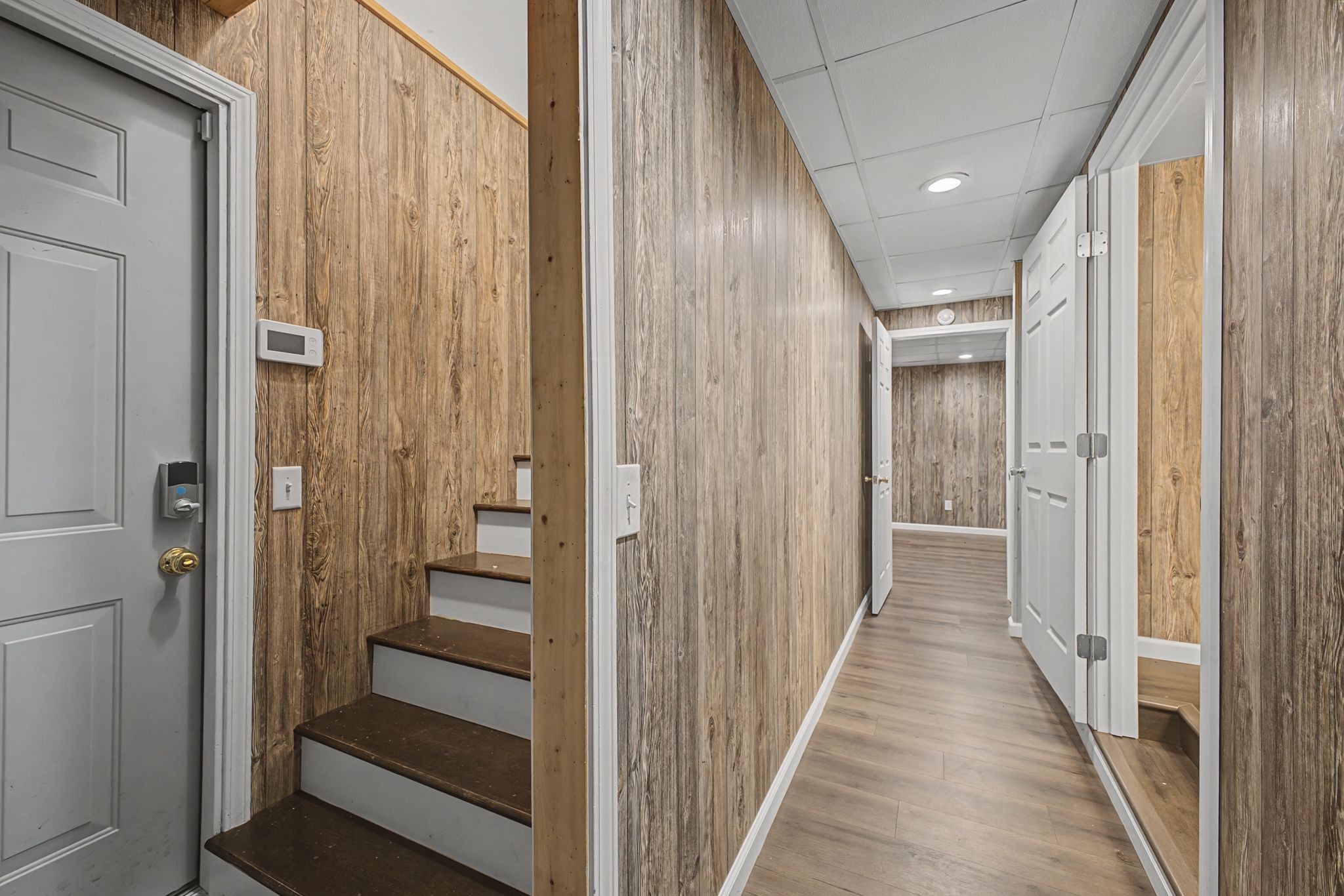 1081 Ridgecrest Drive Kingston Springs, TN 37082 - Photo 29 of 49 a view of a hallway with wooden floor and staircase