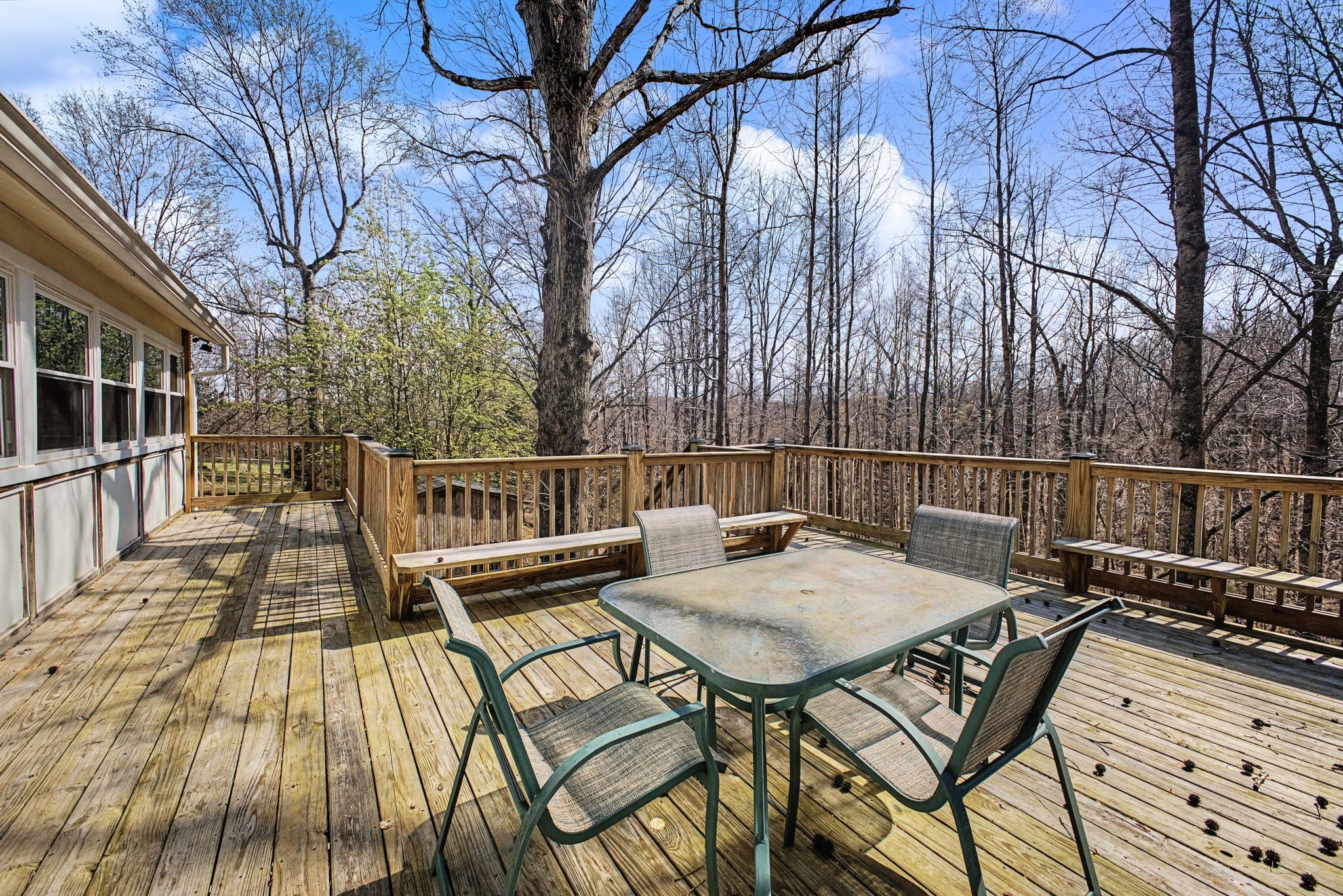 1081 Ridgecrest Drive Kingston Springs, TN 37082 - Photo 38 of 49 a view of a chairs and table on the deck