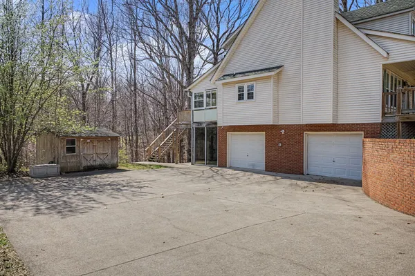 a big house with a large tree in front of it