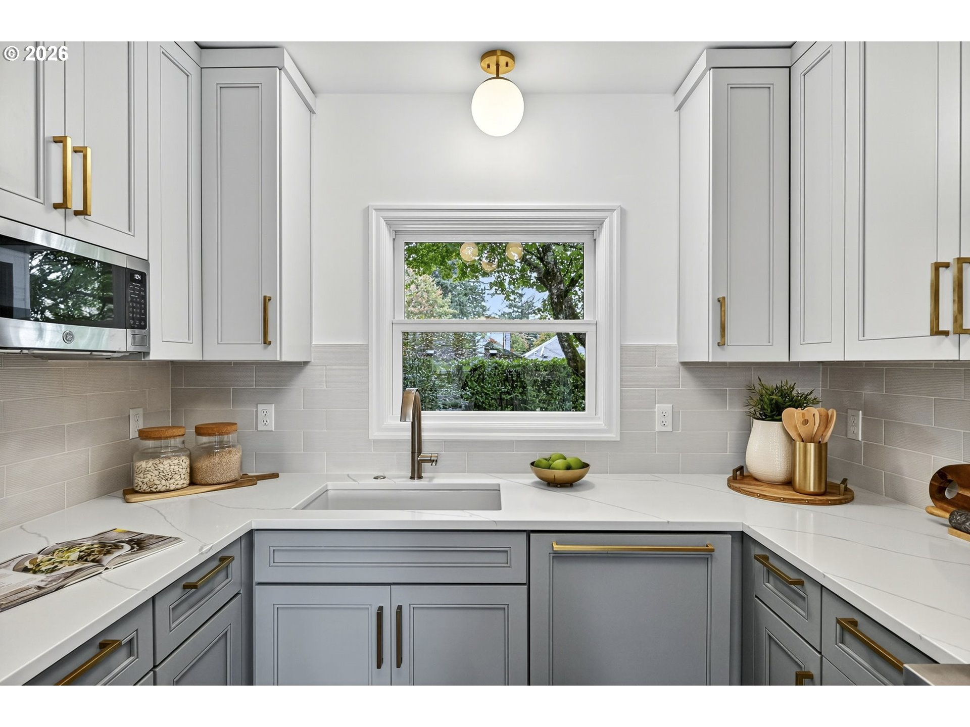 8035 Southwest 8th Avenue Portland, OR 97219 - Photo 16 of 42 a kitchen with stainless steel appliances a sink a stove a counter space and cabinets