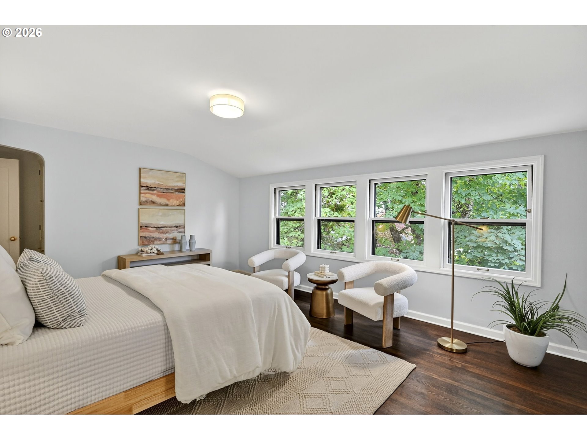 8035 Southwest 8th Avenue Portland, OR 97219 - Photo 25 of 42 a bedroom with a bed and a large window