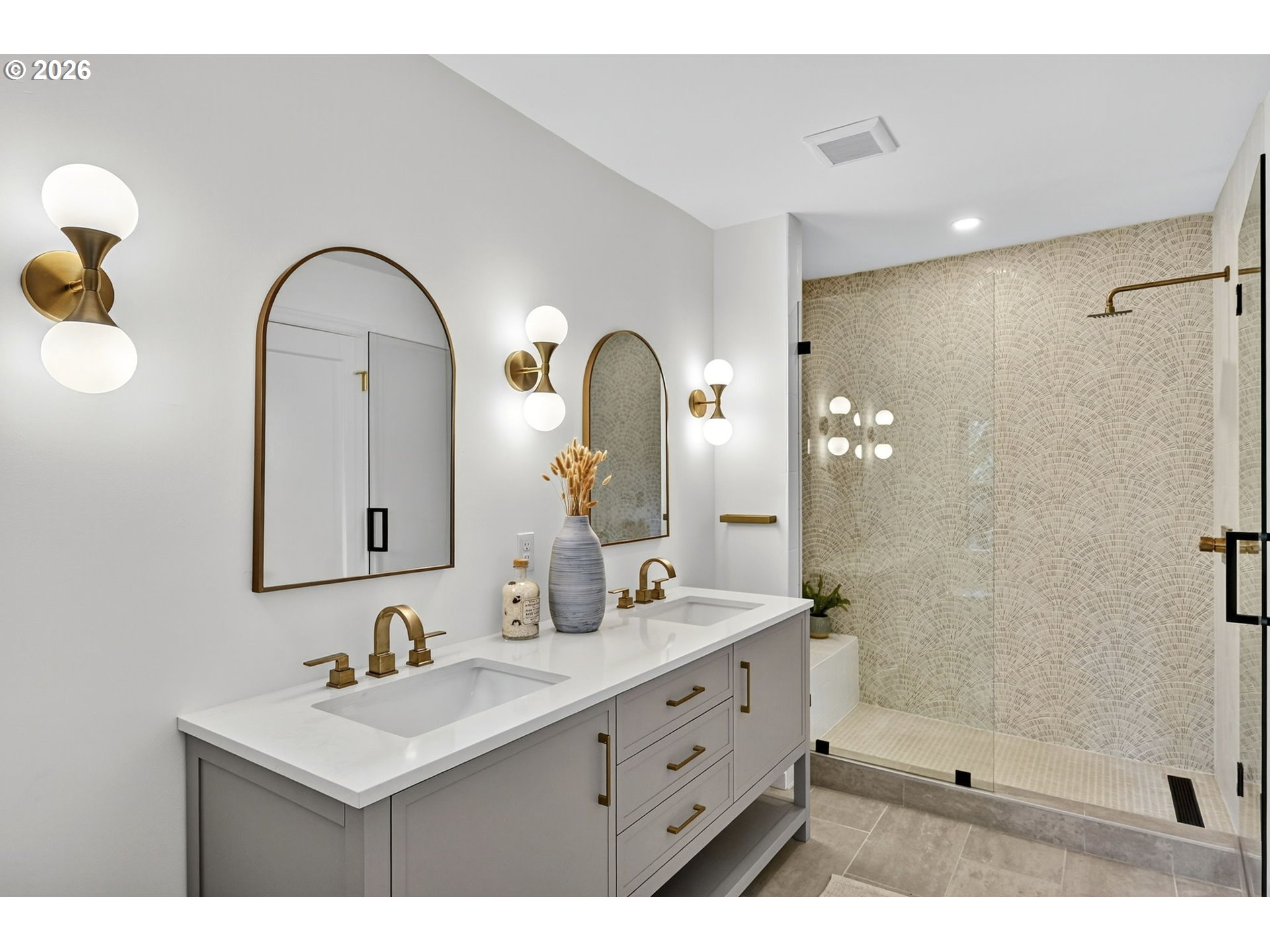 8035 Southwest 8th Avenue Portland, OR 97219 - Photo 26 of 42 a bathroom with a double vanity sink and a mirror