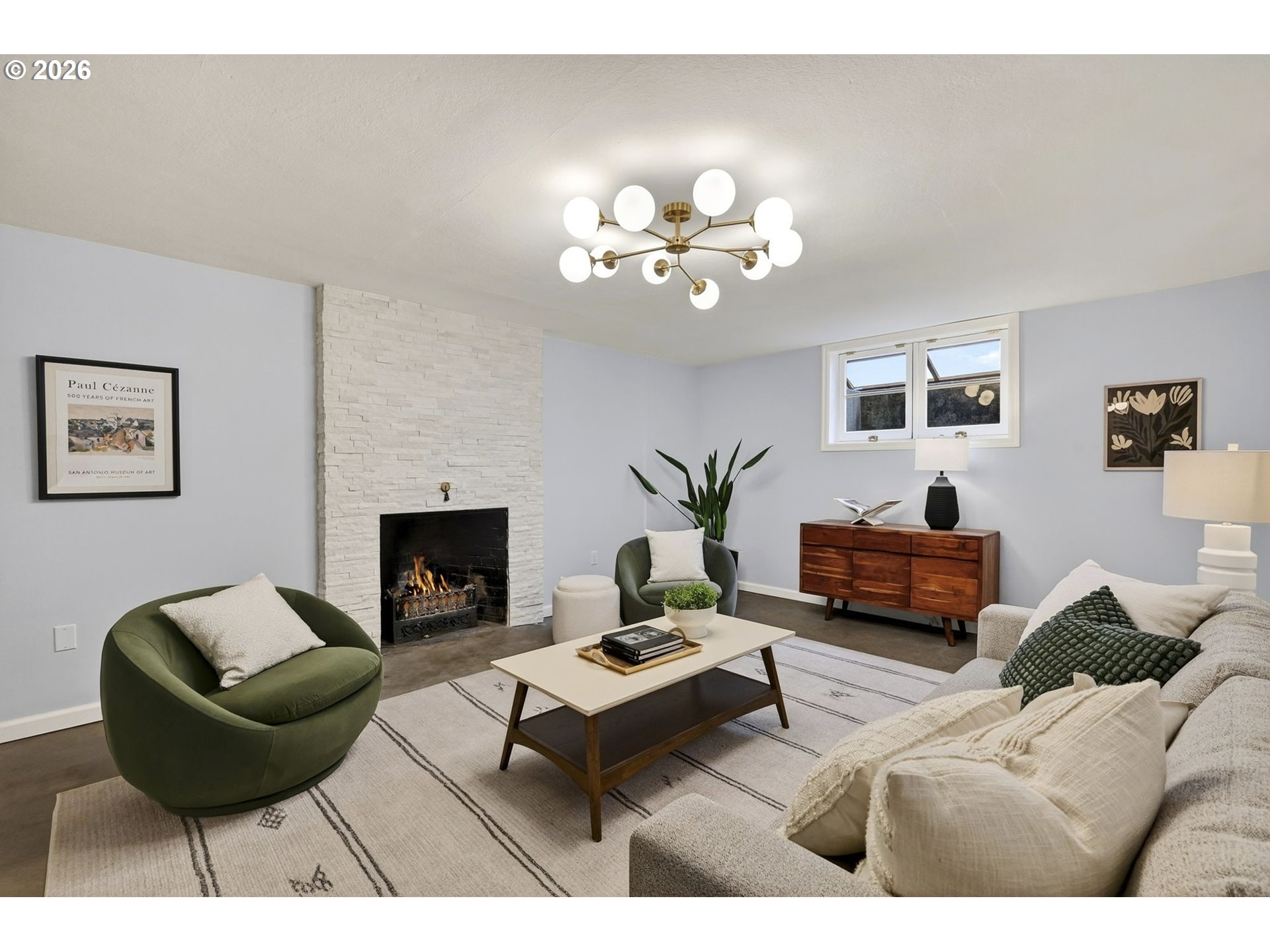 8035 Southwest 8th Avenue Portland, OR 97219 - Photo 30 of 42 a living room with furniture a fireplace and a potted plant