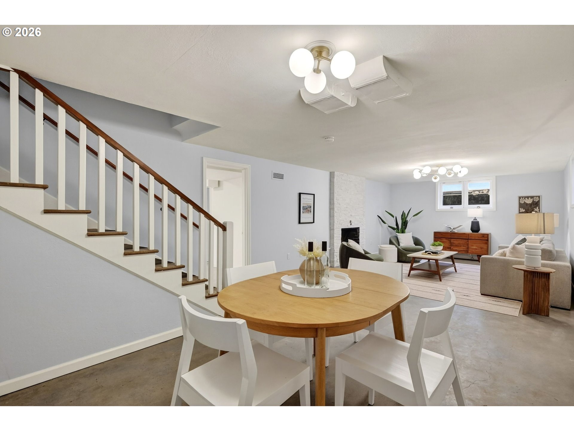 8035 Southwest 8th Avenue Portland, OR 97219 - Photo 32 of 42 a view of a dining room with furniture and a chandelier