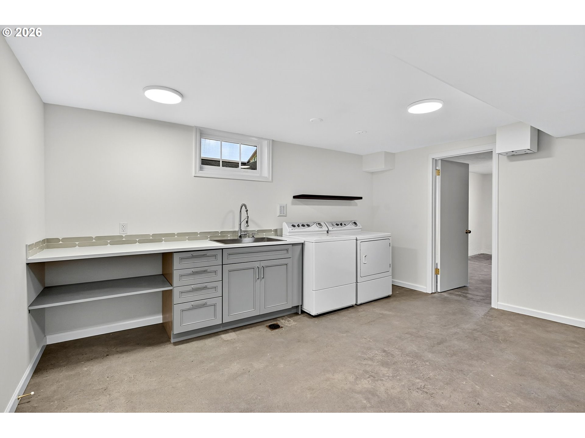 8035 Southwest 8th Avenue Portland, OR 97219 - Photo 33 of 42 a kitchen with cabinets oven and a dishwasher