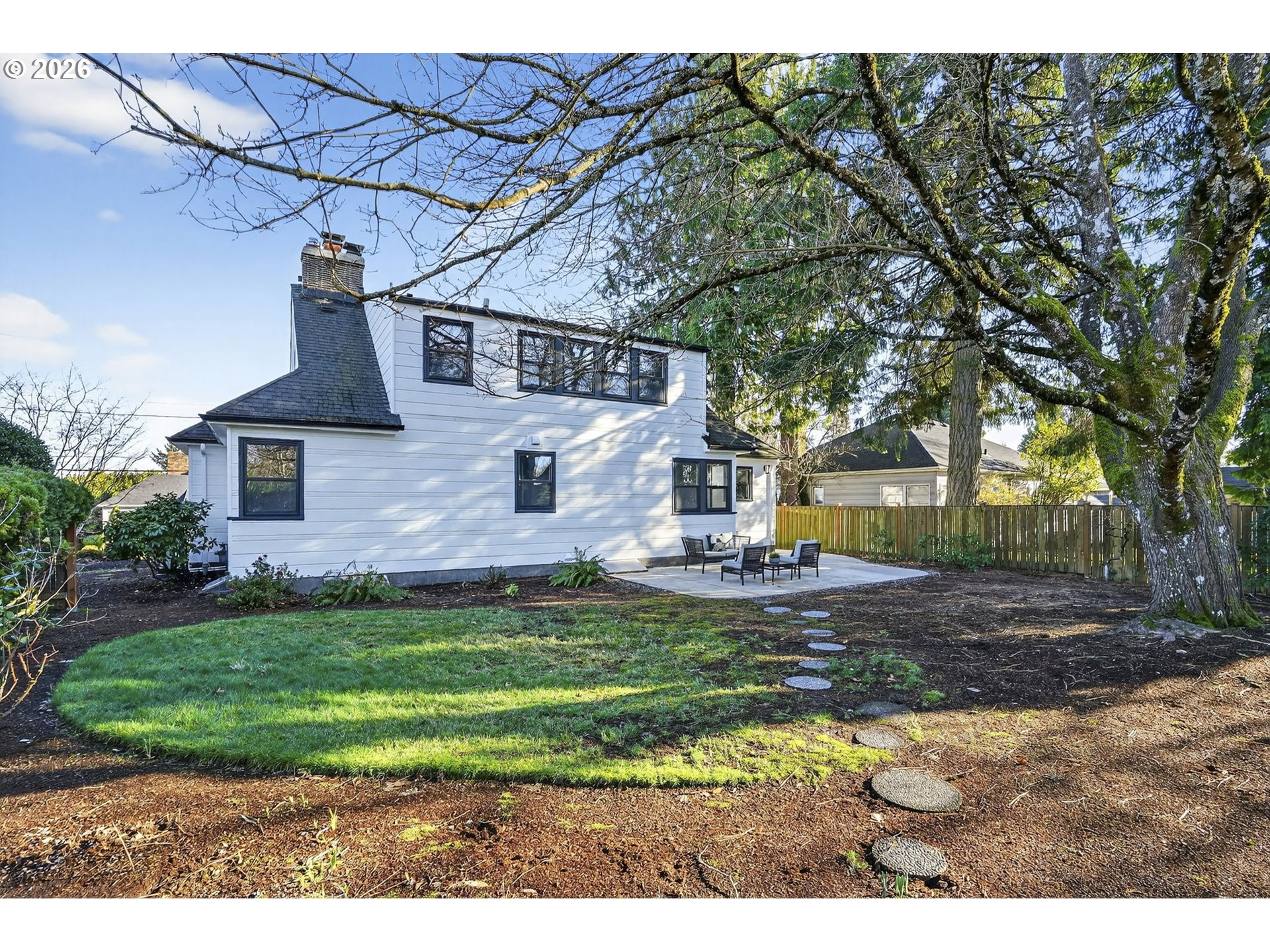 8035 Southwest 8th Avenue Portland, OR 97219 - Photo 37 of 42 a front view of a house with a garden