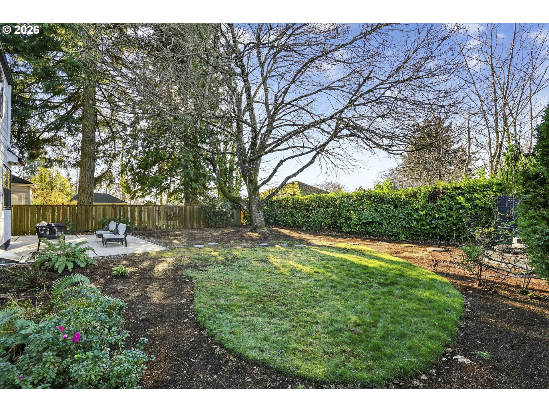 8035 Southwest 8th Avenue Portland, OR 97219 - Photo 39 of 42 a backyard of a house with yard and outdoor seating
