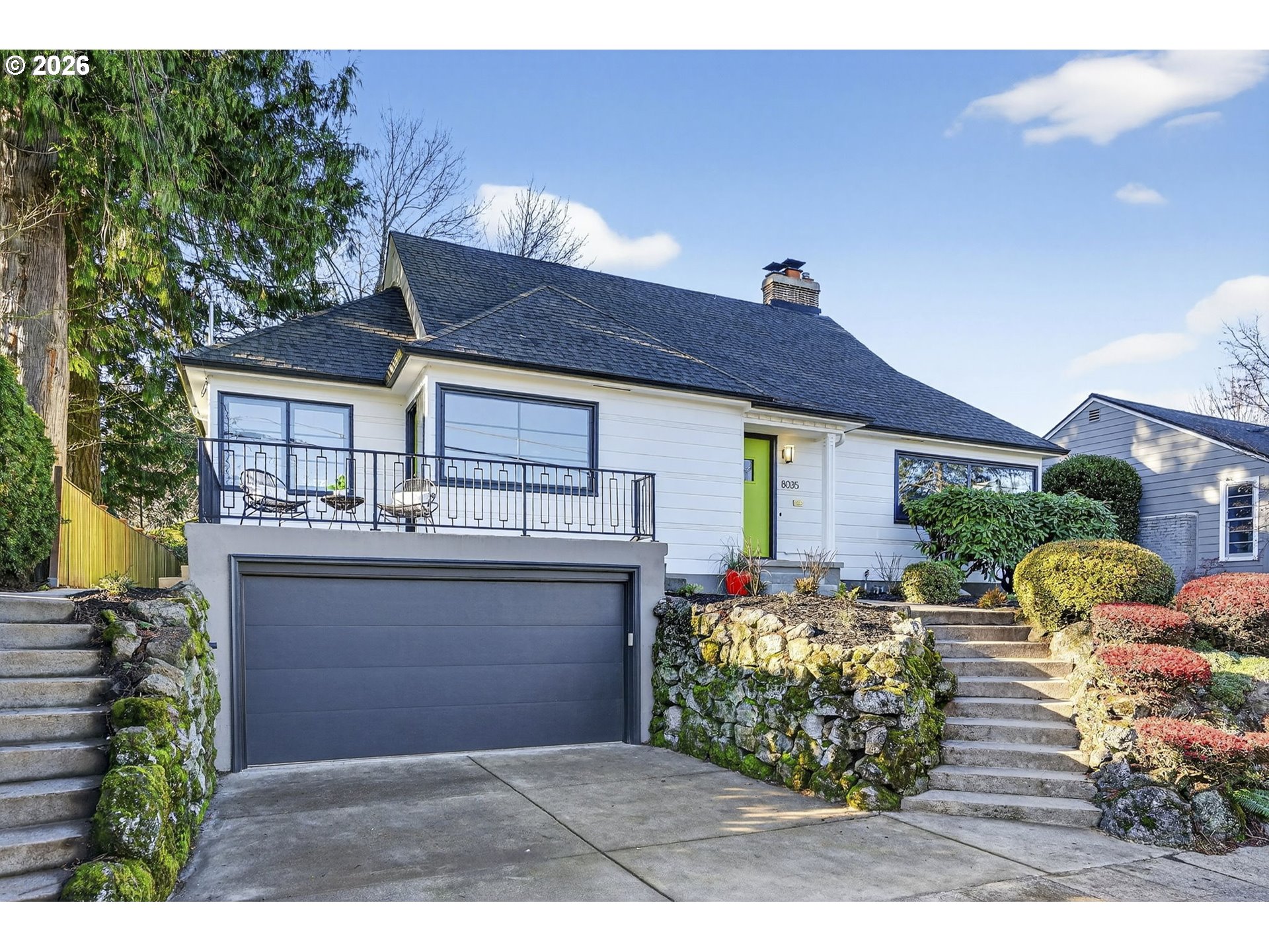 8035 Southwest 8th Avenue Portland, OR 97219 - Photo 4 of 42 a view of a chairs and table in the back yard of the house