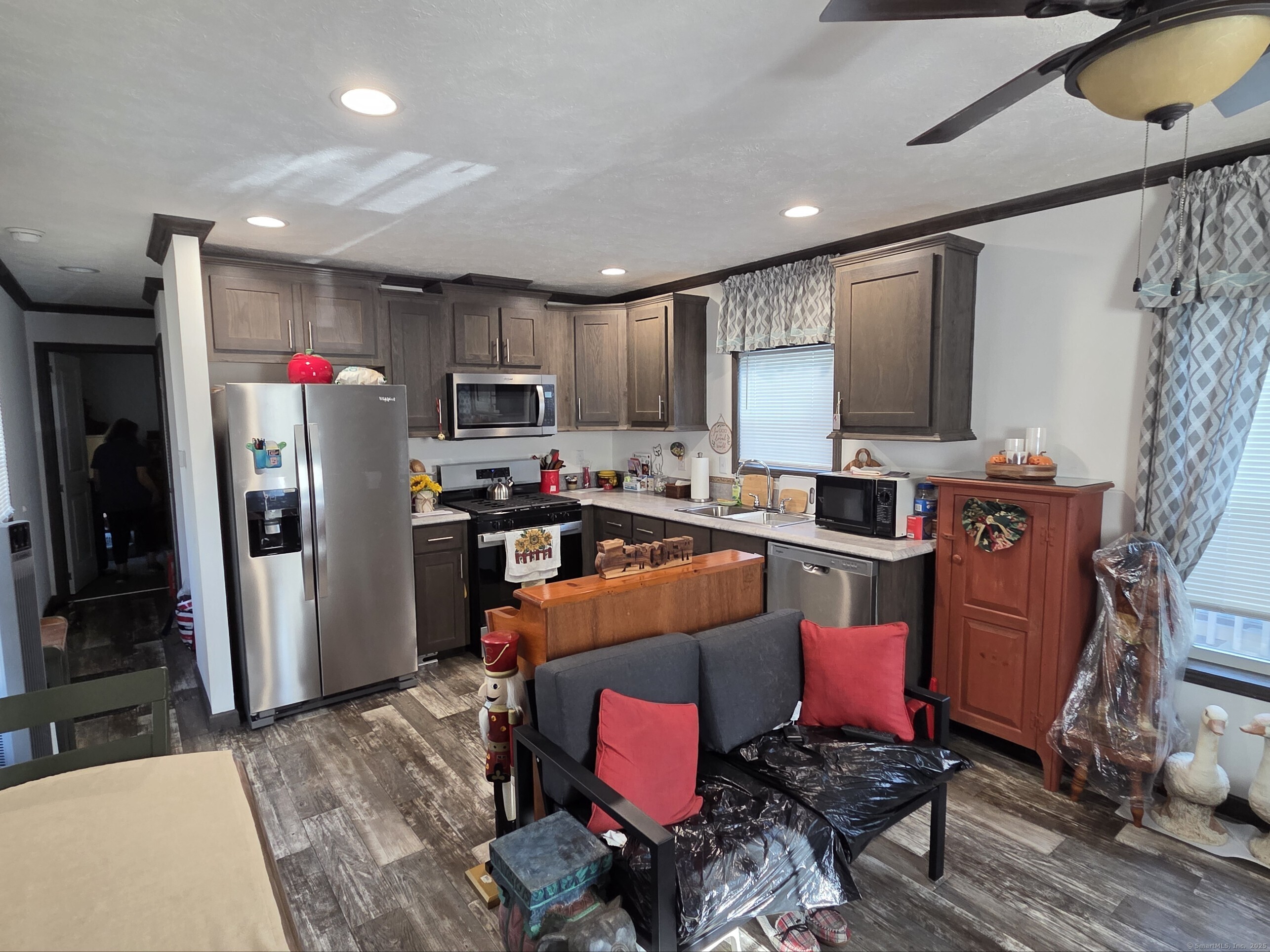 11 School Ground Road Branford, CT 06405 - Photo 4 of 11 a kitchen with stainless steel appliances kitchen island granite countertop a refrigerator a stove top oven a sink and dishwasher