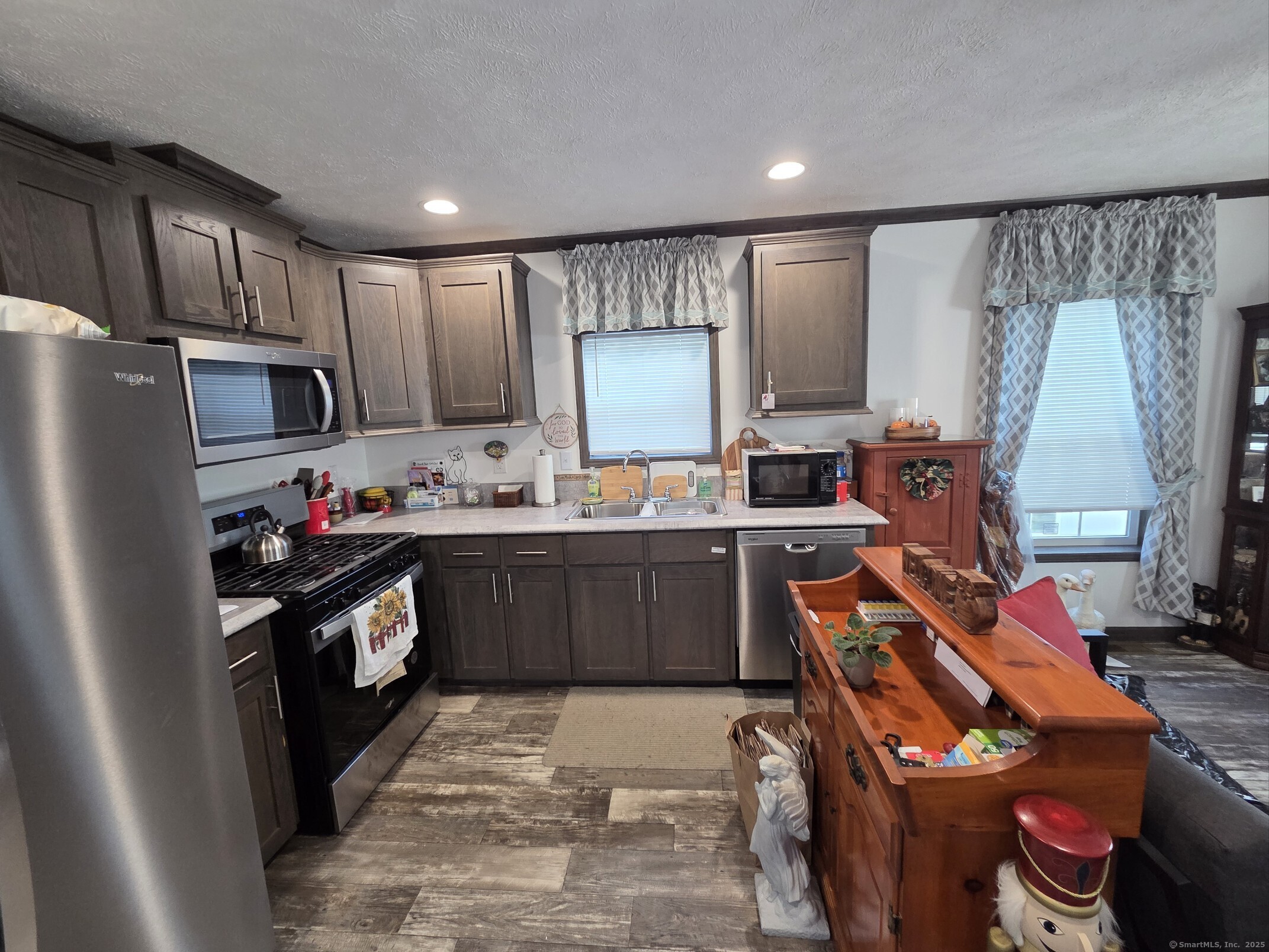 11 School Ground Road Branford, CT 06405 - Photo 5 of 11 a kitchen with stainless steel appliances granite countertop a refrigerator stove and sink