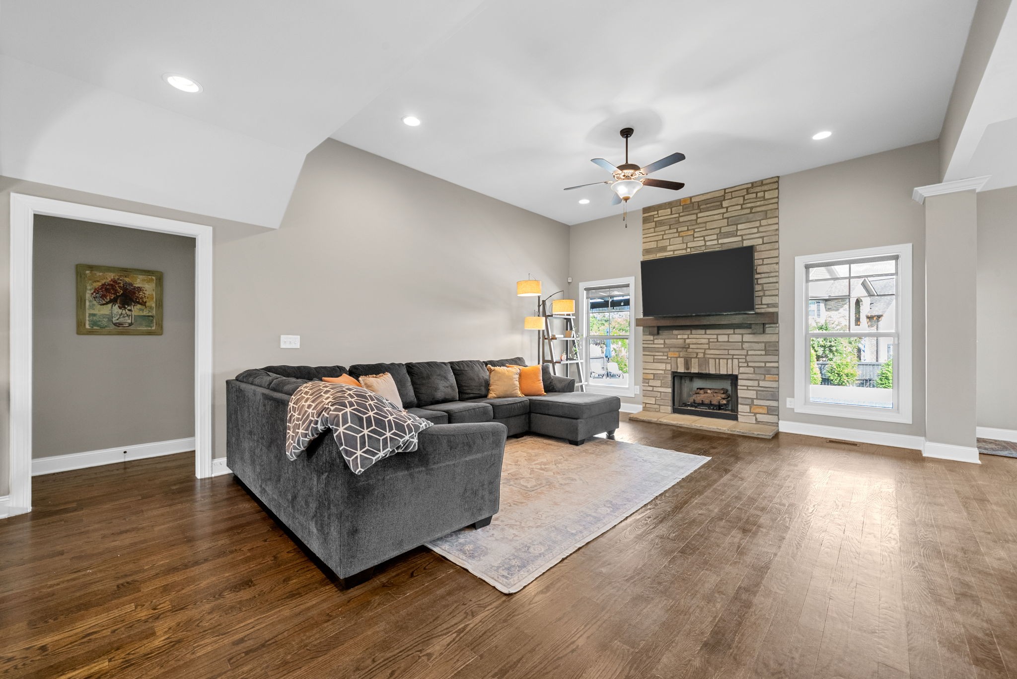 129 Springfield Drive Lebanon, TN 37087 - Photo 11 of 47 a living room with furniture a fireplace and a flat screen tv
