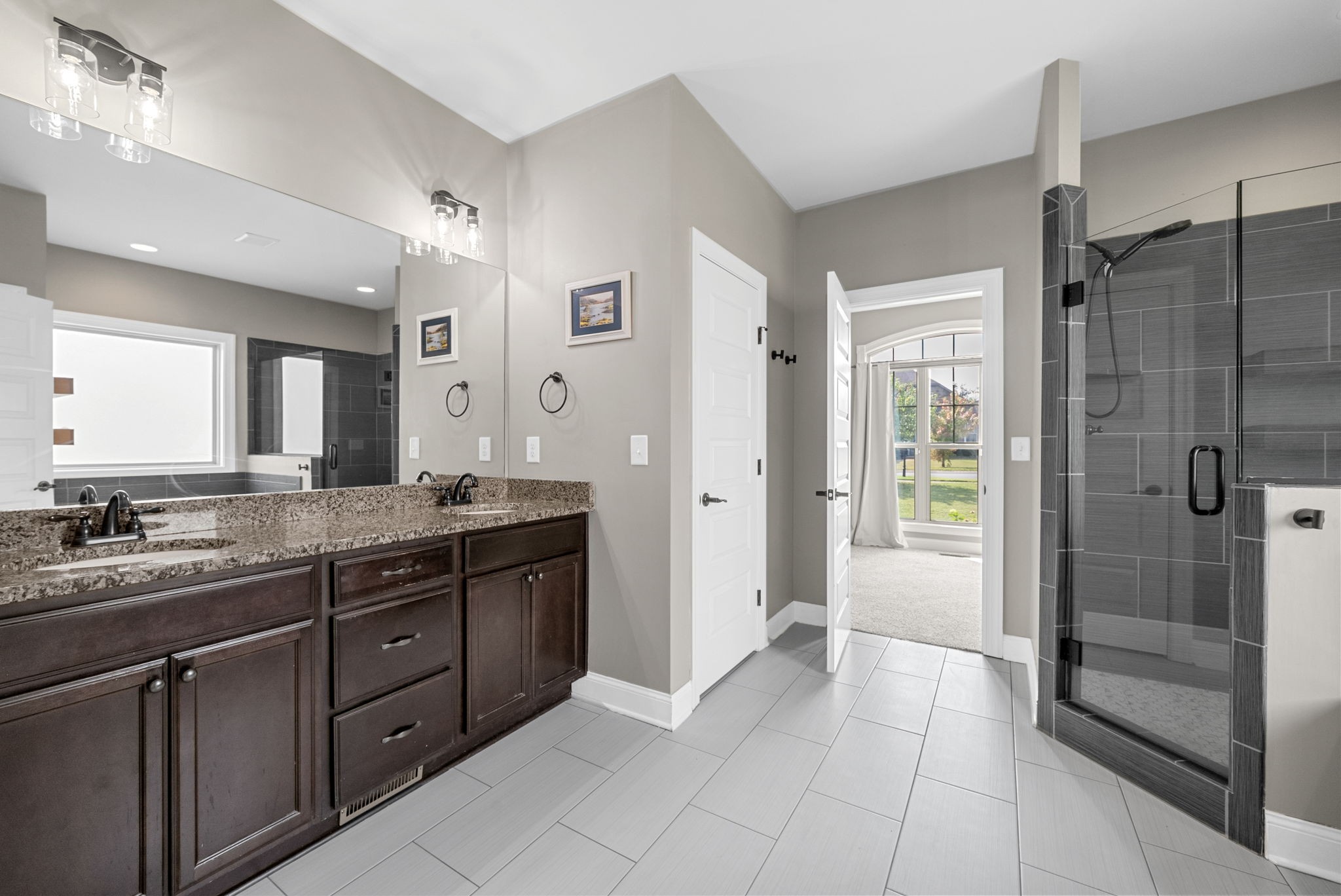 129 Springfield Drive Lebanon, TN 37087 - Photo 32 of 47 a spacious bathroom with a granite countertop sink mirror and shower