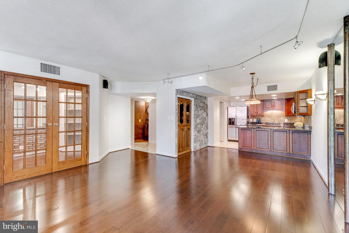 1099 22nd Street Northwest, Unit 304 Washington, DC 20037 - Photo 14 of 44 Den just off Living Room w/ French doors