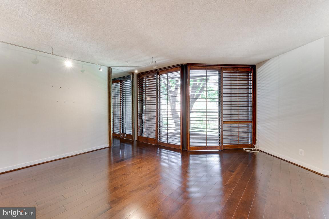 1099 22nd Street Northwest, Unit 304 Washington, DC 20037 - Photo 17 of 44 Living room leading to outdoor space