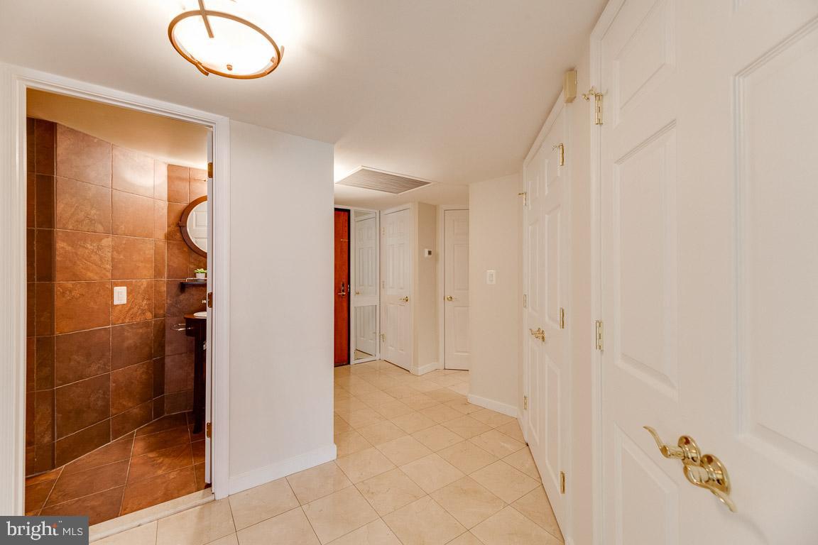 1099 22nd Street Northwest, Unit 304 Washington, DC 20037 - Photo 20 of 44 Powder Room by Front Entryway
