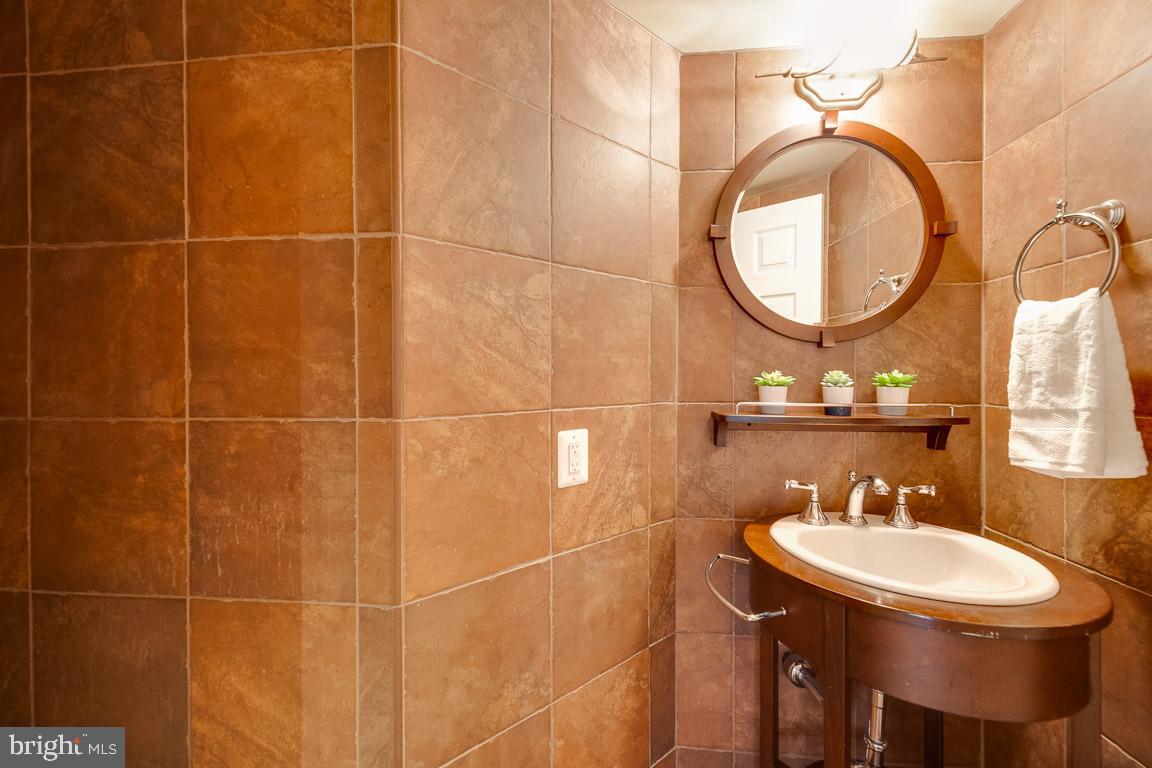1099 22nd Street Northwest, Unit 304 Washington, DC 20037 - Photo 21 of 44 Powder Room w/ ceramic tile throughout