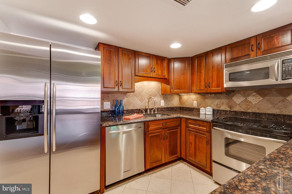1099 22nd Street Northwest, Unit 304 Washington, DC 20037 - Photo 6 of 44 Gorgeous renovated kitchen with custom cabinetry