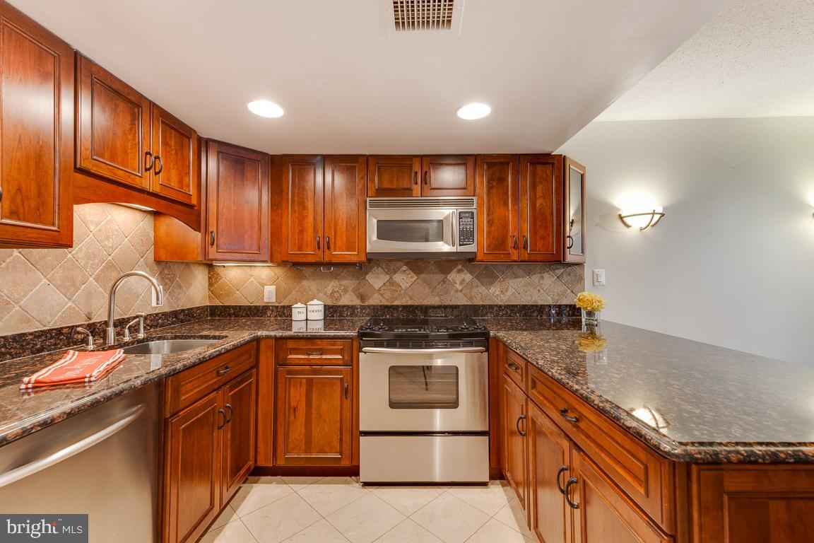 1099 22nd Street Northwest, Unit 304 Washington, DC 20037 - Photo 7 of 44 Gorgeous renovated kitchen with stainless