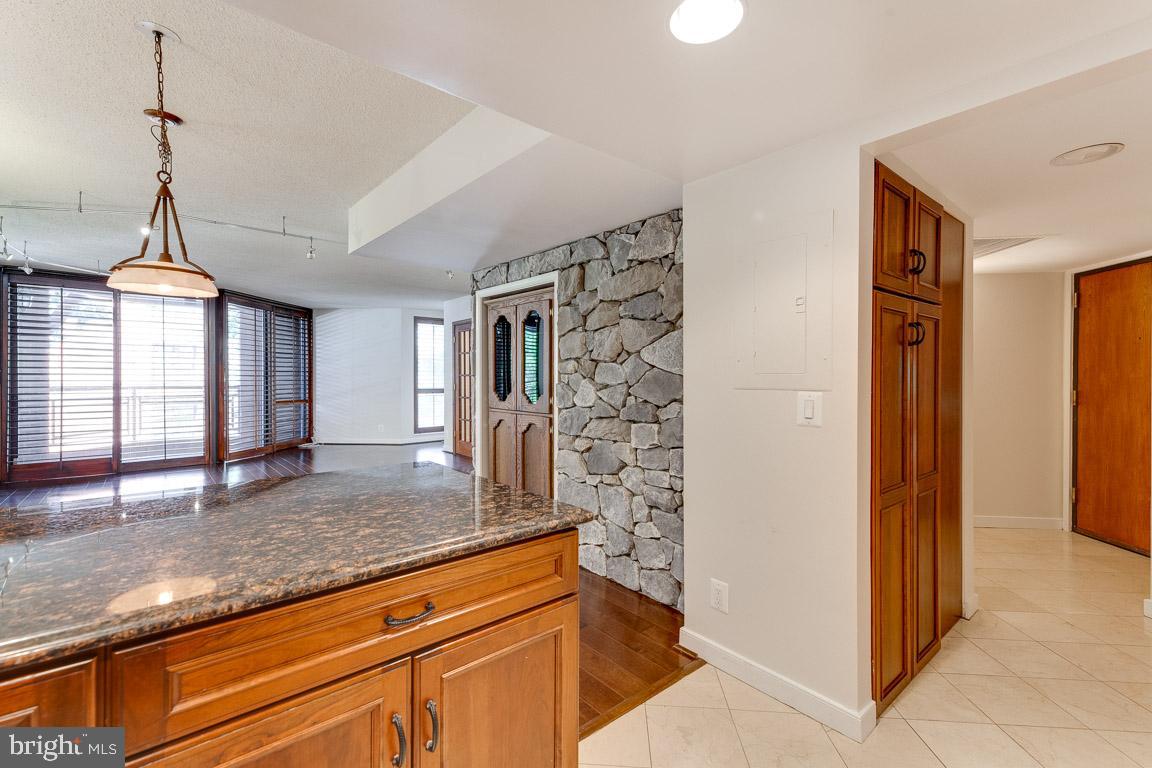 1099 22nd Street Northwest, Unit 304 Washington, DC 20037 - Photo 8 of 44 Pantry in kitchen just by front door. Wine fridge!