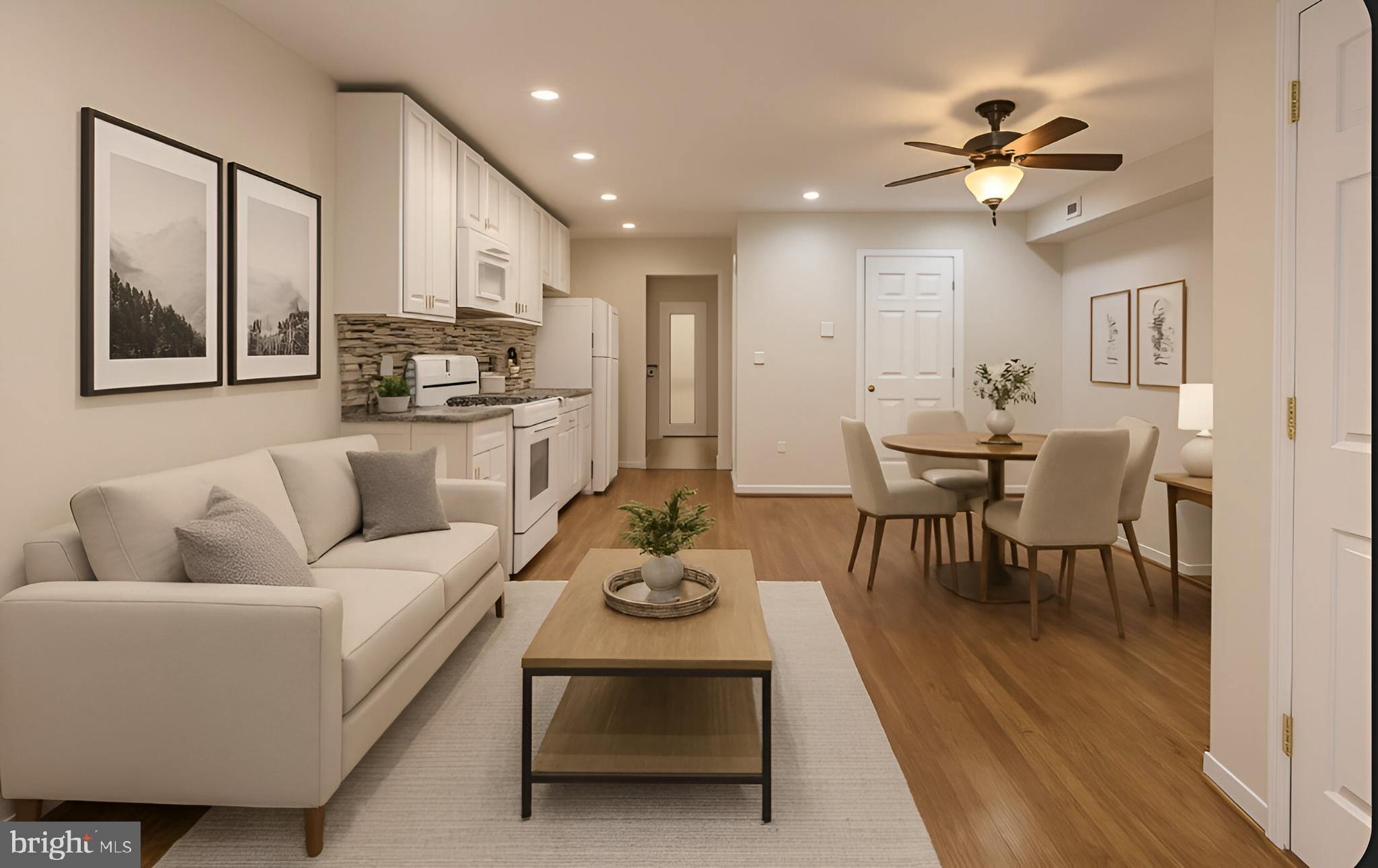 a living room with furniture kitchen and a chandelier